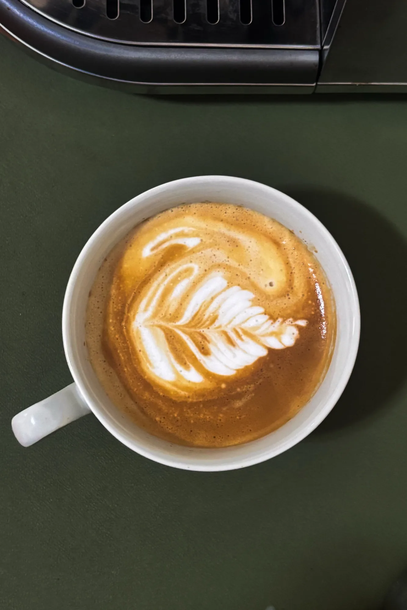 A latte with a rosetta poured into it